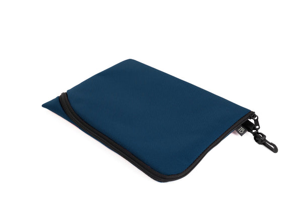 An A5 Ghost Whale Pouch in Deep Blue (dark blue).